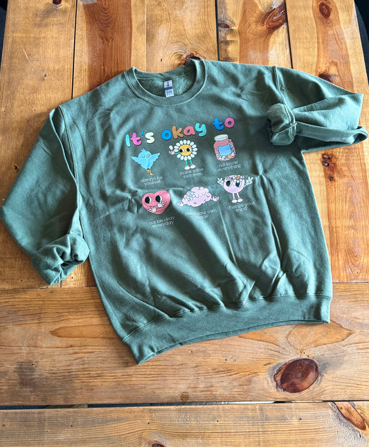 “It’s Okay to Be” Crewneck Military Green Size